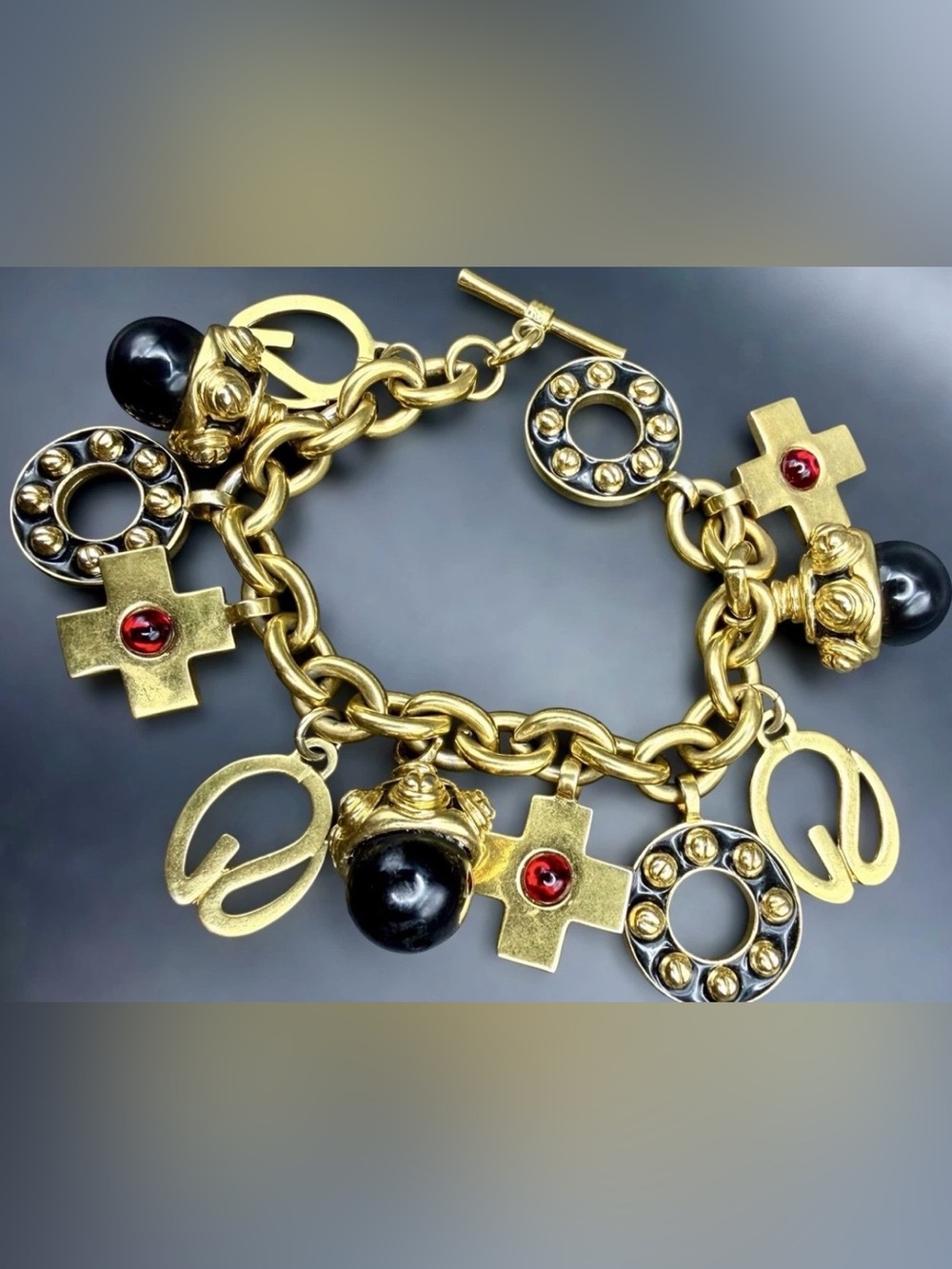 St. John 1990s/Y2K Chunky Gold Plated Charm Bracelet Logo Black Enamel Red Glass